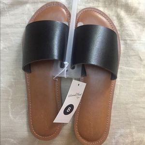 Slip on black sandals